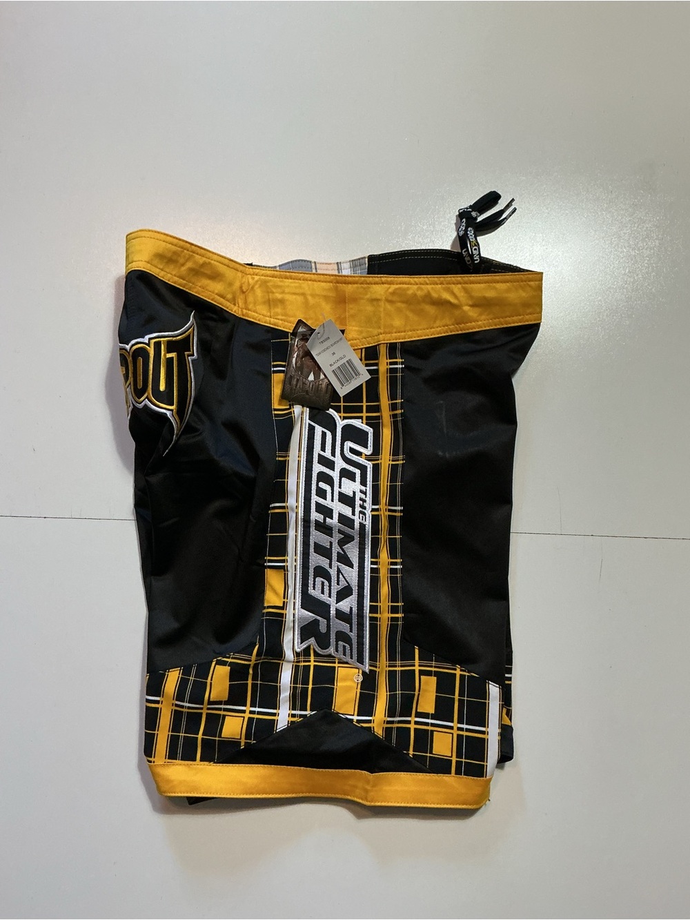 NWT Tapout The Ultimate Fighter UFC
Team Josh Koscheck Black Gold Board Shorts